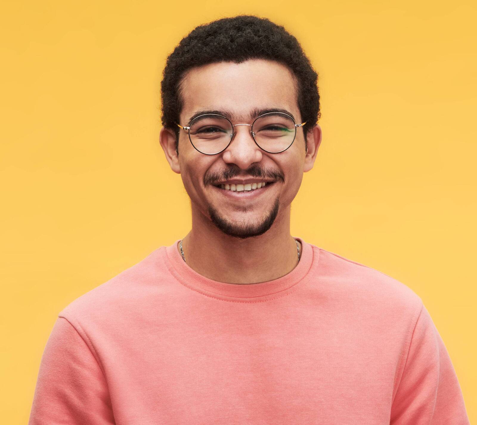 Portrait of a smiling man in glasses